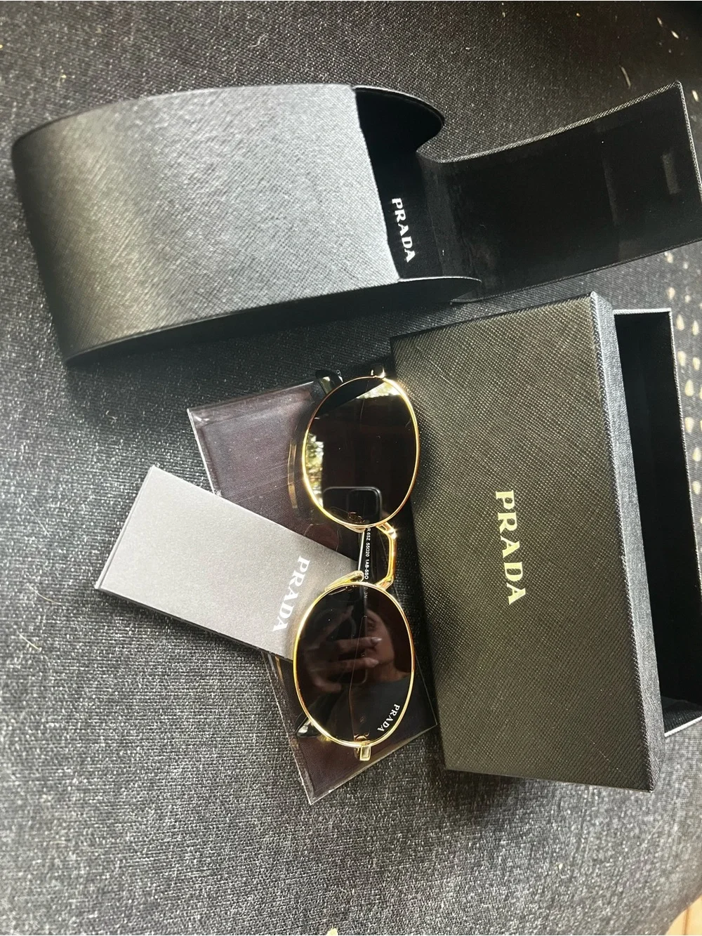 Prada Gold Frame Black Lens Round Sunglasses